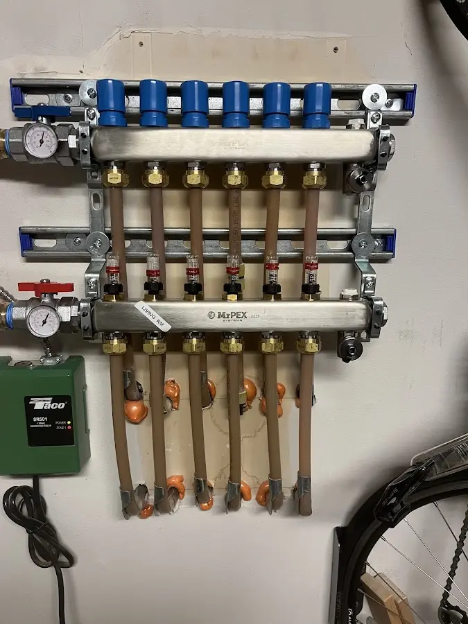 Plumber performing Water Heater Repair at a residential property in Chili